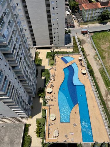 Apto 83B Lazer de resort a poucos passos da praia in Guaruja, Brasil