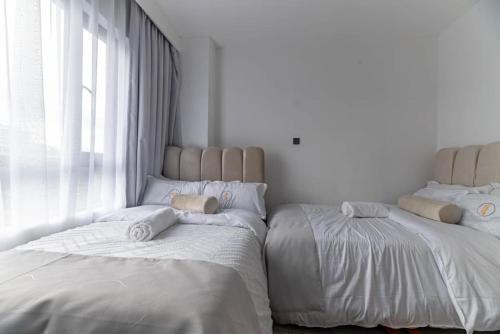 Elegant modern retreat residencies with heated swimming pool fully equipped gym and rooftop chillspot with amazing breathtaking city views