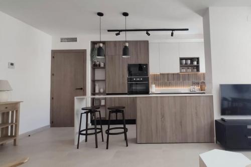 Piso reformado de diseA o c terraza. Playa el Ancla in El Puerto De Santa Maria, Spain