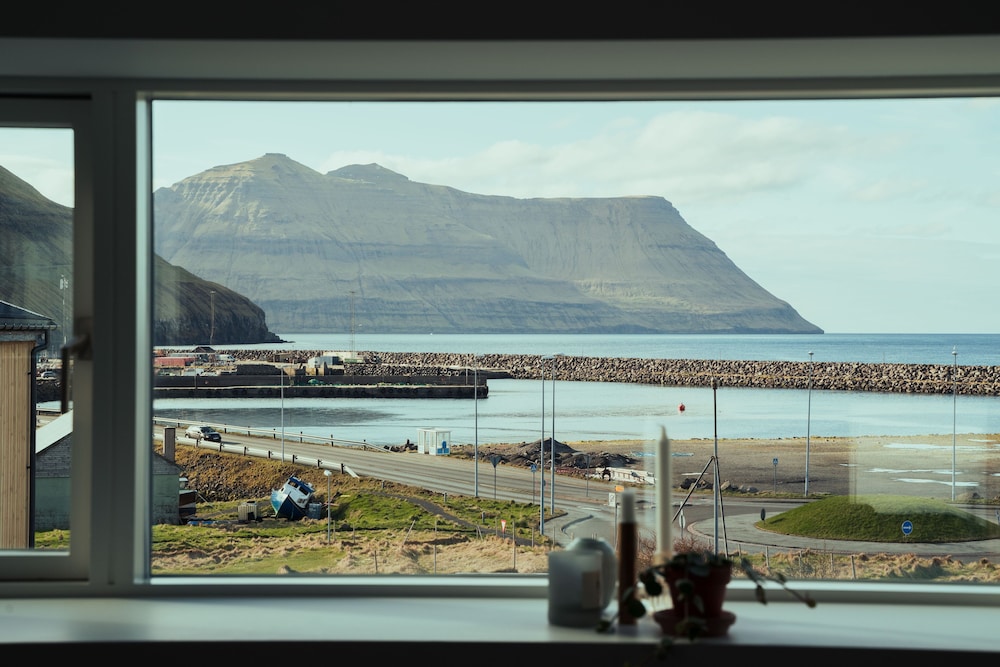 Serenity by the Fjords Stunning Views in Unknown City, Faroe Islands