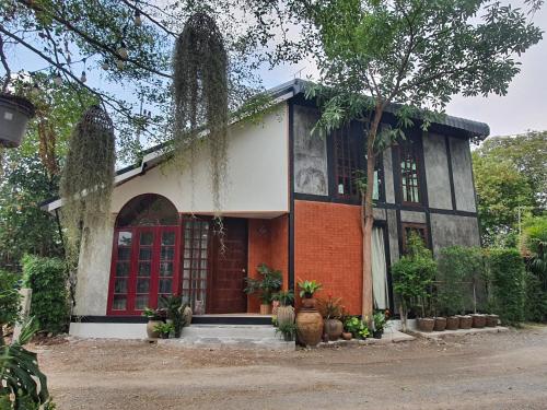 บ้านนกฮูกอิงไม้ Baannokhook - carbon neutral hotel in Sena