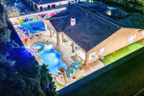 BigBiggie with Waterslide and 100k Game Room in Indio, United States