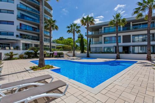 Seaview Serenity with Pool & Garden — 4-Star Luxury Hotel in Quarteira, Portugal