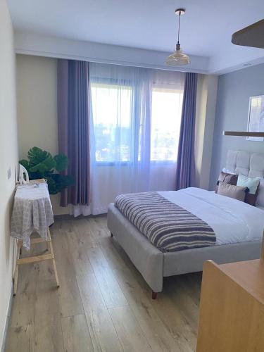 The elegant cozy two bedroom apartment with amazing city views heated swimming pool fully equipped gym and a child play area and free parking space