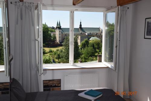 Yellow Peaked Shoe Apartment — 4-Star Luxury Hotel in Krakow, Poland