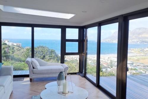 Modern mountainside home with ocean view Minimal load shedding