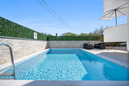 Aquarius Apartments Beachside with Heated Pool — 4-Star Luxury Hotel in Vodice, Croatia