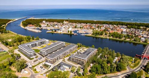 Apartament DZIWNA RIVER z frontowym widokiem na rzekę i basenem Dziwnów EPapartamenty — 4-Star Luxury Hotel in Dziwnow, Poland