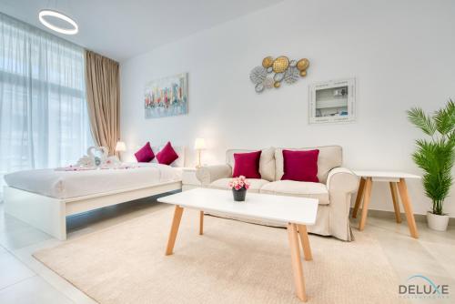 Balcony Offering Community Views 1BR with Assistant Room Walking Distance to Community Park Pantheon Elysee Jumeirah Village Circle by Deluxe Holiday Homes — 4-Star Luxury Hotel in Dubai, United Arab Emirates