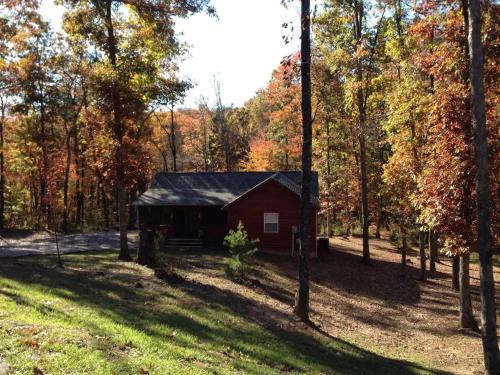 Gas fireplace firepit and cedar Adirondack chair — hotel in Spencer