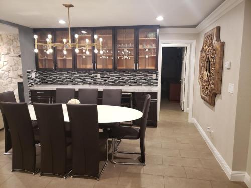 Luxury Villa with bonus pool house Private Pool Hot tub rock water fall and slide putting green basketball shuffle board play gym privately gated on circular driveway.