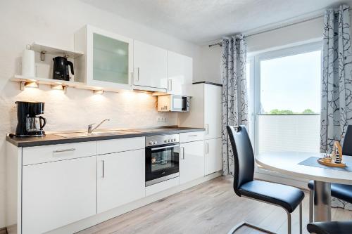 Ferienwohnung Seestern mit Rundbogenfenster am Badesee Tannenhausen — 4-Star Luxury Hotel in Aurich, Germany