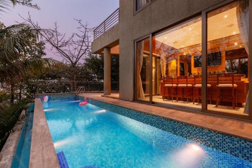 The Blue Horizon by StayVista Featuring a beach view villa with a swimming pool indoor games and a relaxing balcony — 4-Star Luxury Hotel in Alibag, India