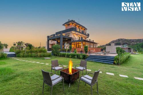 StayVista’s Shivoham Farms Mountain View Villa with Outdoor Pool Lawn and Terrace