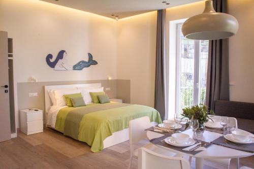 Sirena Partenope e San Gennaro HOME Rione Sanità Centro Storico Napoli — 4-Star Luxury Hotel in Naples, Italy