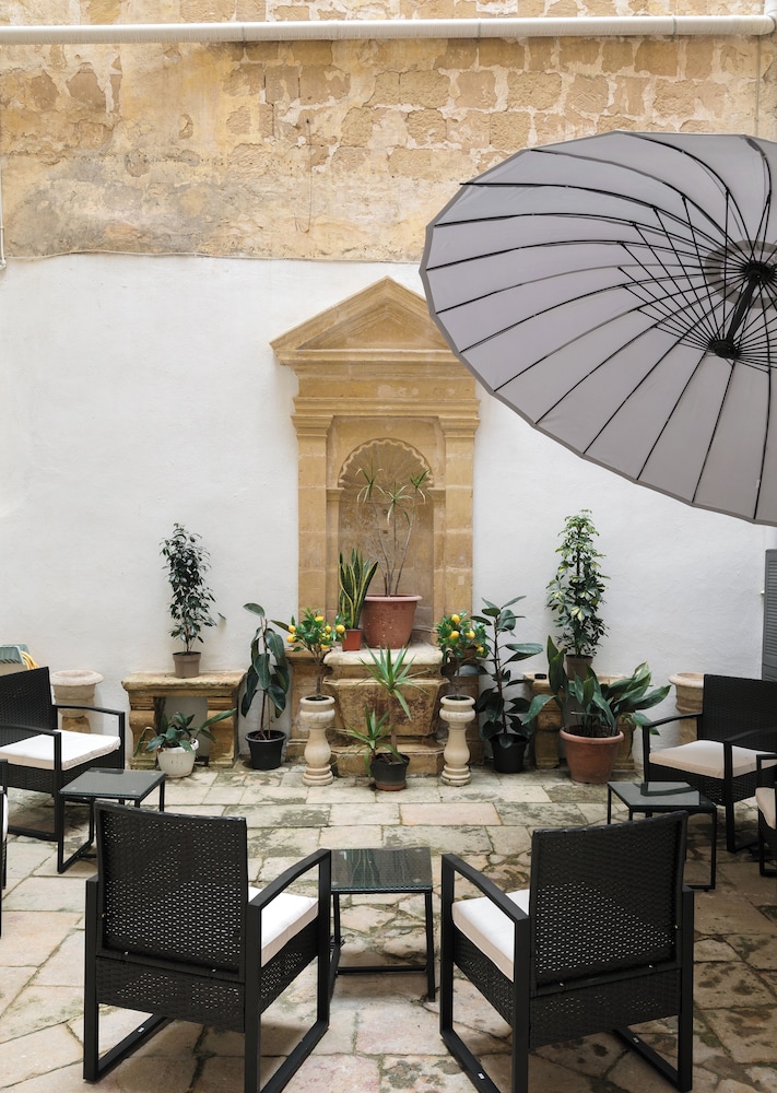 Traditional Apartment with Maltese Internal Court Yard Designed with Traditional Stone and Tiling — 4-Star Luxury Hotel in Valletta, Malta