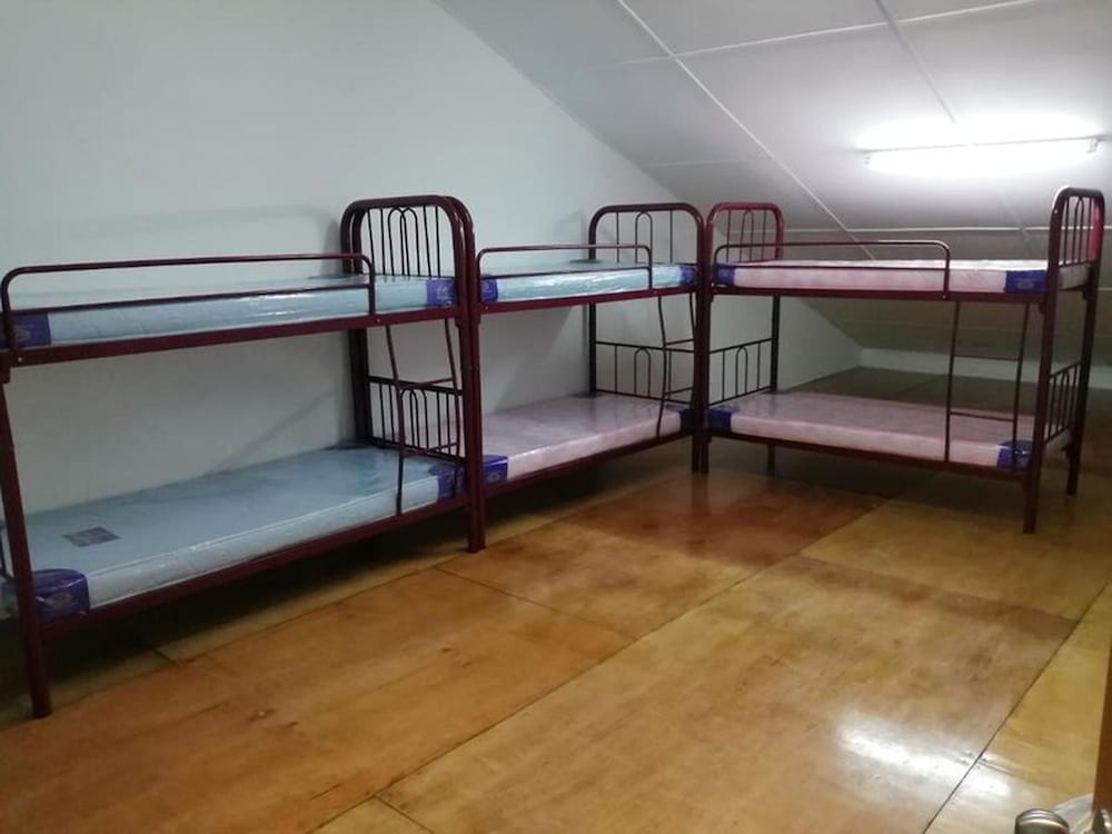 Single Bed in Mixed Dormitory Room With Ac - carbon neutral hotel in Kuching