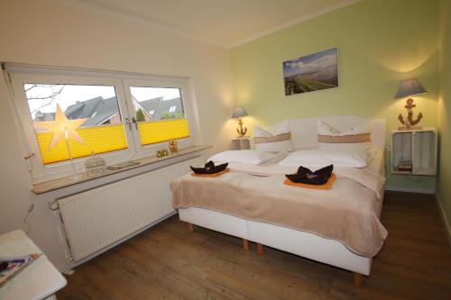 Am Oland 13 hinten — 4-Star Luxury Hotel in Busum, Germany