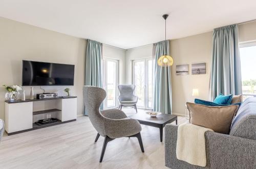 5 Sterne Ferienwohnung Boddenkieker mit großer Eckterrasse und Boddenblick — 4-Star Luxury Hotel in Wustrow, Germany