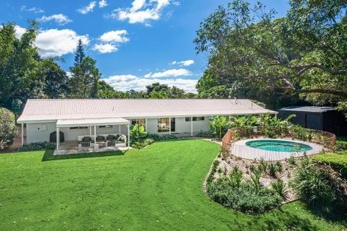 Hidden Byron designer hinterland oasis with pool fireplace and firepit in Brunswick Heads, Australia