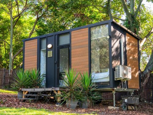 Jacaranda Mews by Tiny Away - carbon neutral hotel in Unknown City
