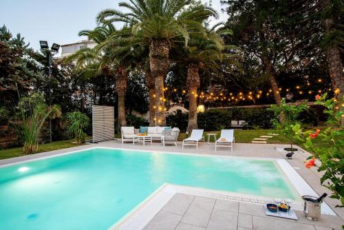 Numeroquattro Light Green Open Space con vista sul giardino e piscina — 4-Star Luxury Hotel in Siracusa, Italy