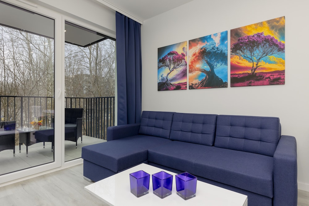 Dark Blue and Grey Apartment with Pastel Bedroom in Warsaw by Noclegi Renters — 4-Star Luxury Hotel in Warsaw, Poland