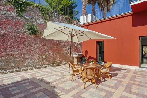 Dimora Burrafato Antico Palazzo sul Lungomare — 4-Star Luxury Hotel in Marina Di Caronia, Italy