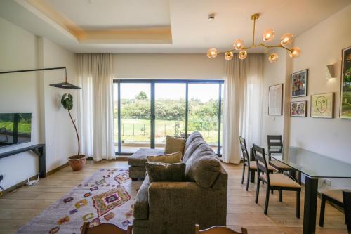 Riverbank One Bedroom Apartment Swimming pool gym workspace DB Space Living