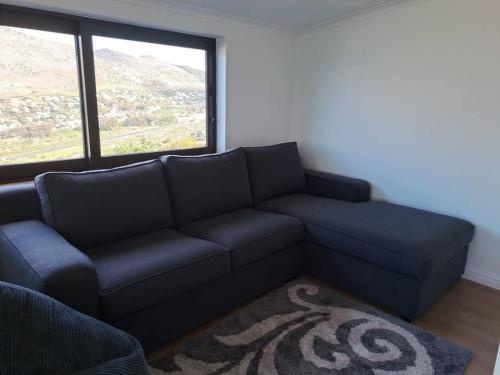 Modern mountainside home with ocean view Minimal load shedding