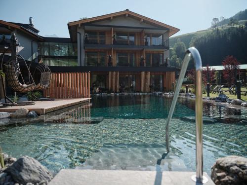 Wellness und Brunch Hotel MorgenZeit beheizter Naturteich Genuss Frühstück bis 13 Uhr Hochkönig Sommercard in Maria Alm Am Steinernen Meer, Austria