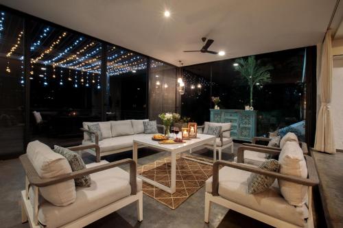 Open House by StayVista Nestled in nature featuring a Swimming pool & Expansive lawn for a serene retreat