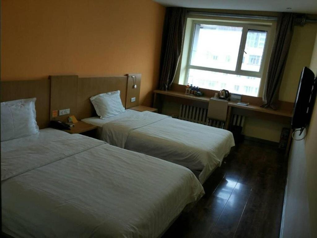 7 Days Inn He Gang Jin Guang Building Branch — hotel in Hegang