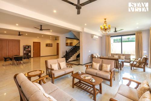 StayVista’s Shivoham Farms Mountain View Villa with Outdoor Pool Lawn and Terrace