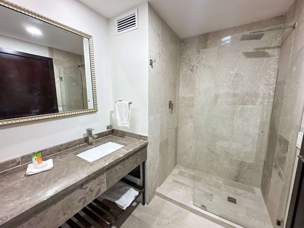 Enjoy a sleek bathroom with a large shower, a stylish vanity, and cozy towels. Everything you need for a refreshing stay is right here.