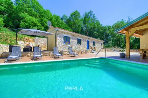 Cozy holiday house CAPREE with pool in a quiet location near the beach Rabac — 4-Star Luxury Hotel in Labin, Croatia