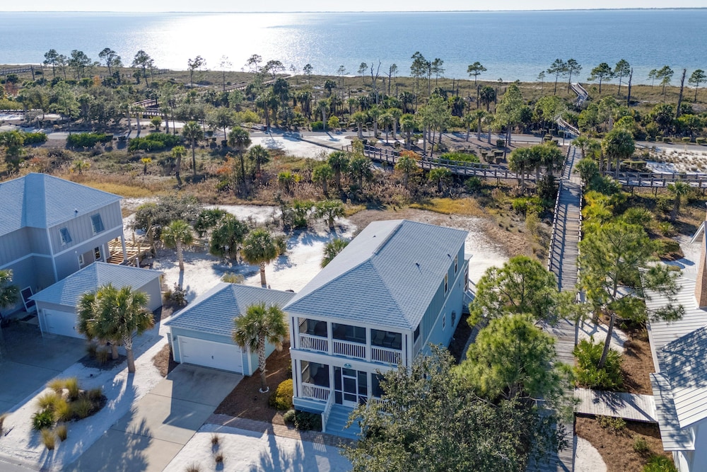 Steps to Shore: Windmark Beach Retreat w Balcony in Port Saint Joe, United States
