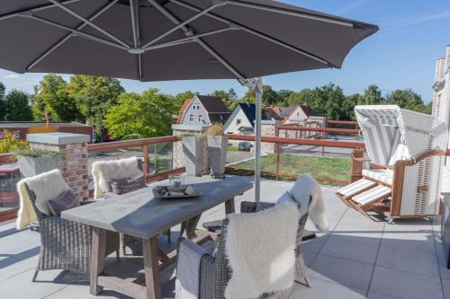Inselblume 47 Luxus Ferienwohnung in Burg mit Dachterrasse — 4-Star Luxury Hotel in Burg Auf Fehmarn, Germany