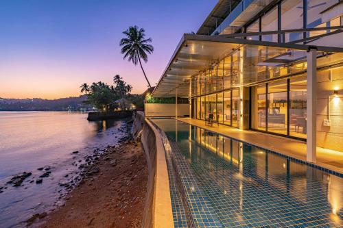 Oceanic Sunsets with River View Comp Breakfast & Infinity Pool at StayVista in Panaji, India