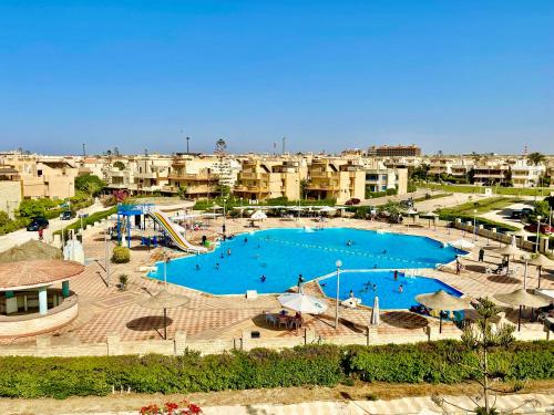 Sea & Pool View Deluxe Chalet Prime Spot in Badr Resort in Al `Alamayn, Egypt