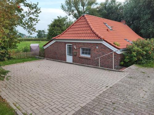Fischerhaus am Deich 45233 — hotel in Jemgum