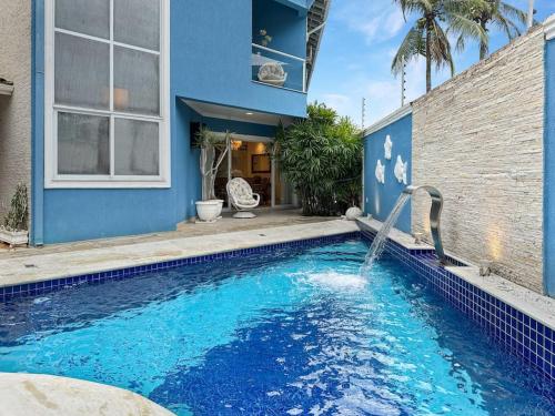 Pousada 50m da Praia 2 Suítes com Ar Condicionado Cozinha Privativa Piscina in Guaruja, Brasil