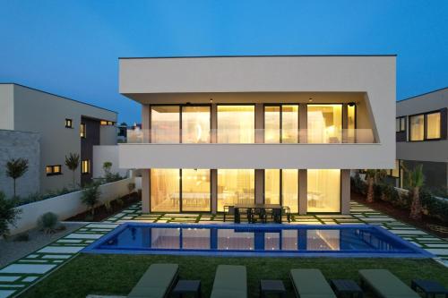 Adria Resort SEAFRONT Villa B Quiet Beachfront Retreat with Private Pool in Unknown City, Croatia