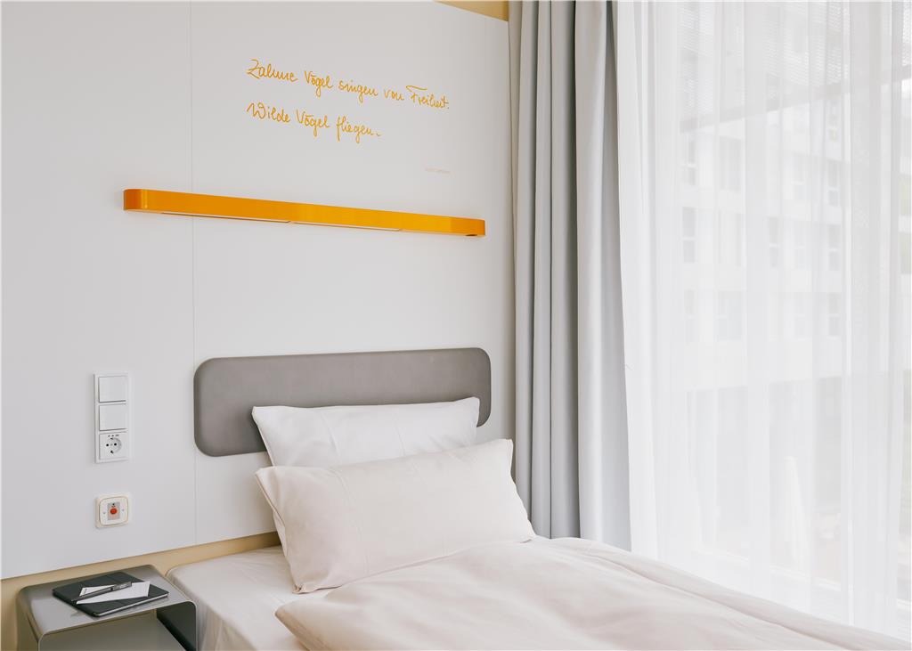 Single bed with emergeny call button next to it