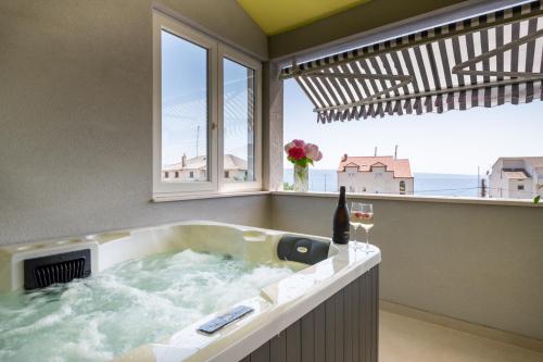The Penthouse Harmony Beachfront with Hot Tub — 4-Star Luxury Hotel in Jesenice, Croatia