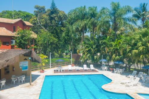 Flat com serviços na Riviera in Bertioga, Brasil