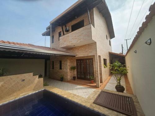 Sobrado Aviação piscina churrasqueira jacuzzi in Praia Grande, Brasil