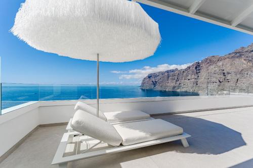 Blue Haven Ocean View Penthouse with Private Jacuzzi And Community Pool in Los Gigantes, Spain