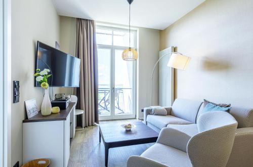 Kleine Welle Haustierfreundliches Zwei Zimmer Apartment mit Südbalkon und Platz für drei Personen im ersten Obergeschoss — 4-Star Luxury Hotel in Wustrow, Germany