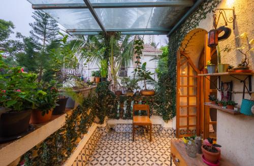 SaffronStays Birdsong 3BR pet friendly villa with lawns treetop terraces gazebo dining & tennis court